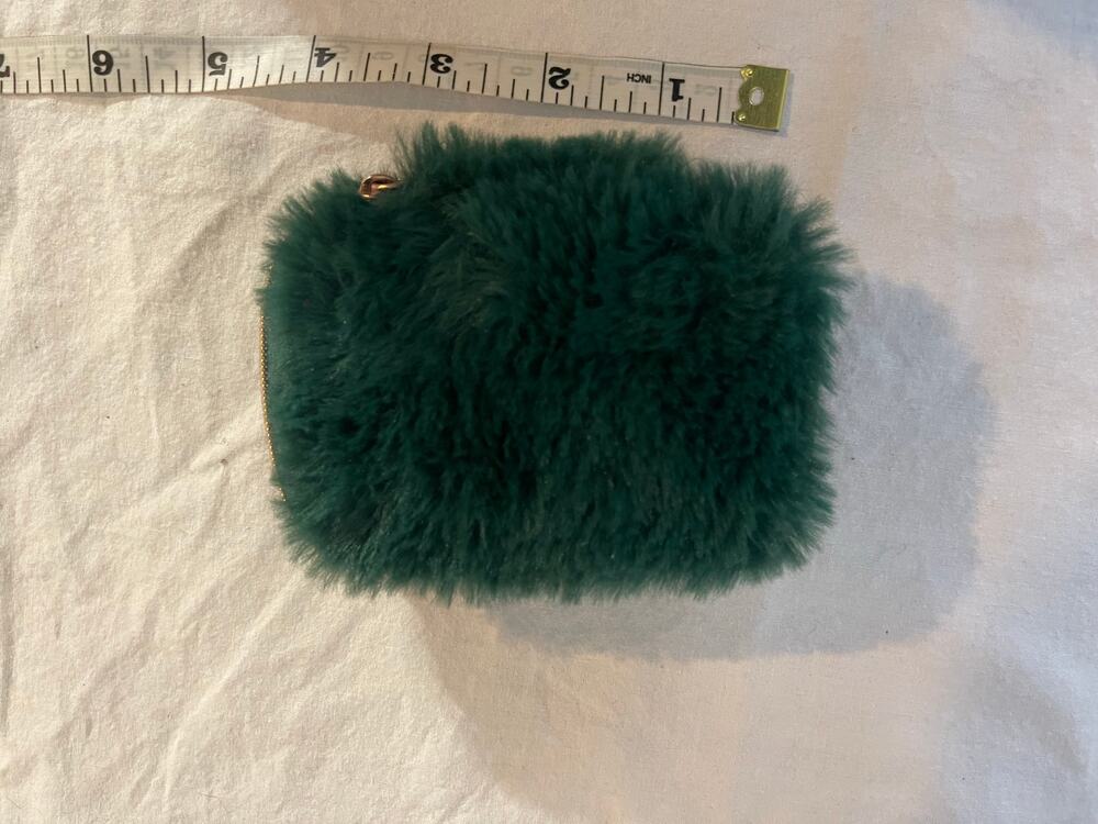 Green fluffy earbud holder